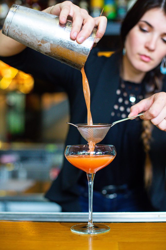 Bartender crafting one of Vidrio's Classic mixed drinks, in Downtown Raleigh NC.