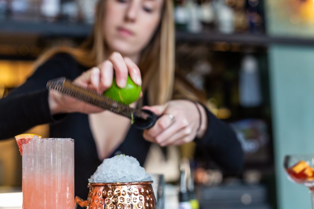 Bartender crafting one of Vidrio's Classic mixed drinks, in Downtown Raleigh NC.