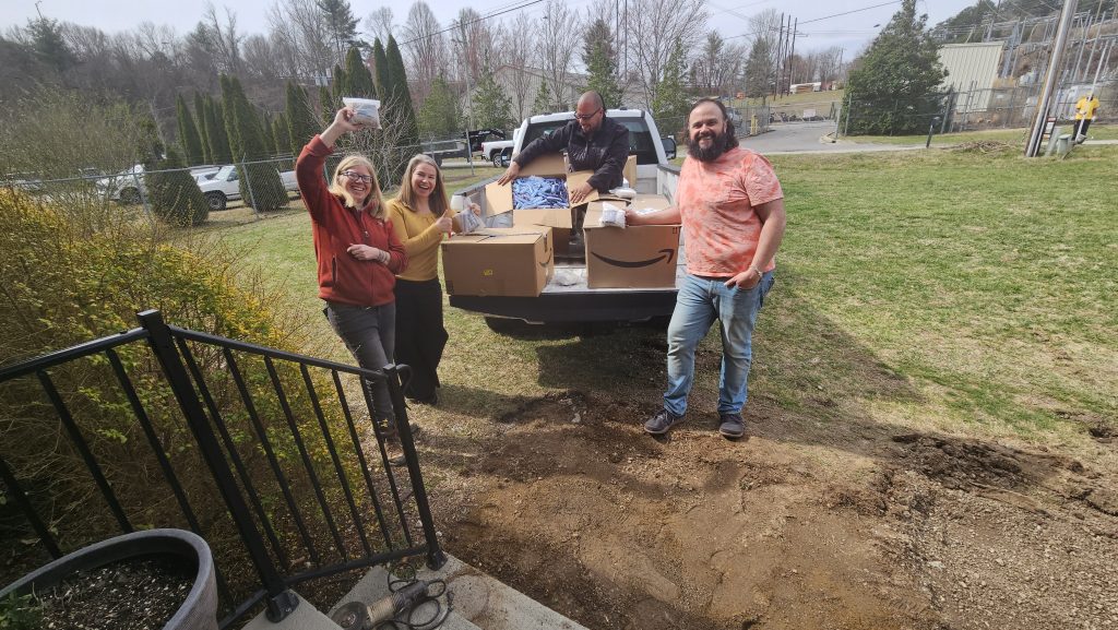 BeLoved Asheville NC Team working to unload the support provided by LM Restaurants.