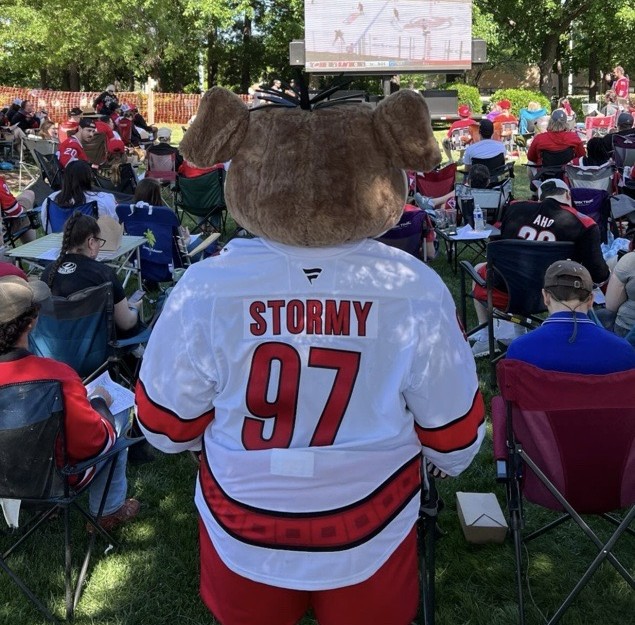 Carolina Hurricanes Mascot Stormy watching the game at a Carolina Ale House watch party