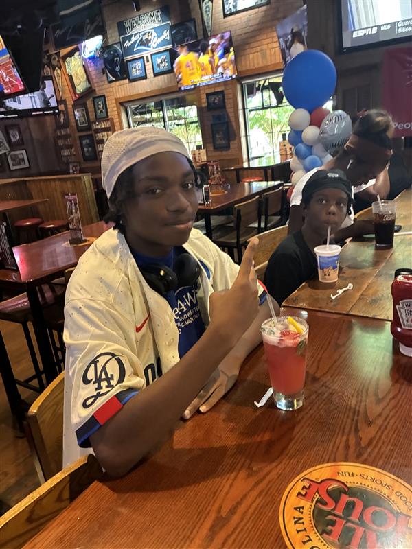 Carolina Ale House Concord Mills, NC, team granting a wish through the Make-A-Wish Foundation in July 2025.