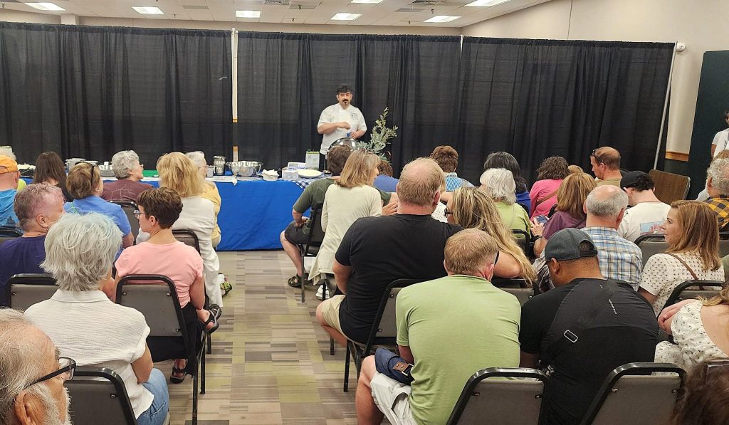 Chef Spyros of Taverna Agora teaching at the 2025 Raleigh Greek Fest