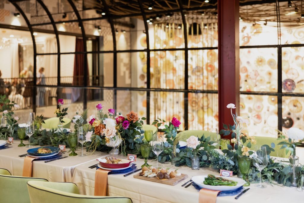 Vidrio Raleigh - Upstairs private event space with table set and food displays shown