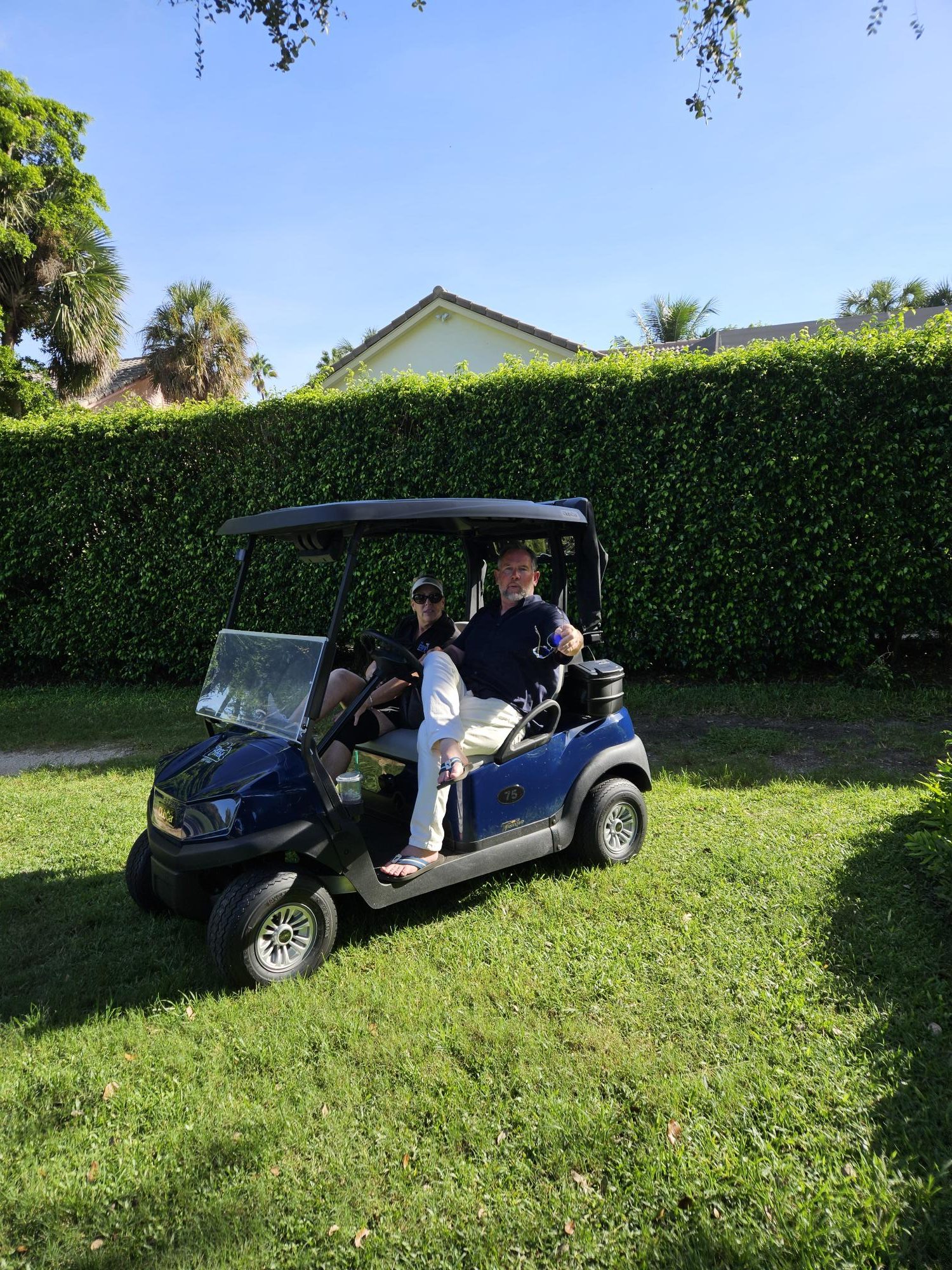 The Cove team at the annual tournament 2026 - riding golf cart