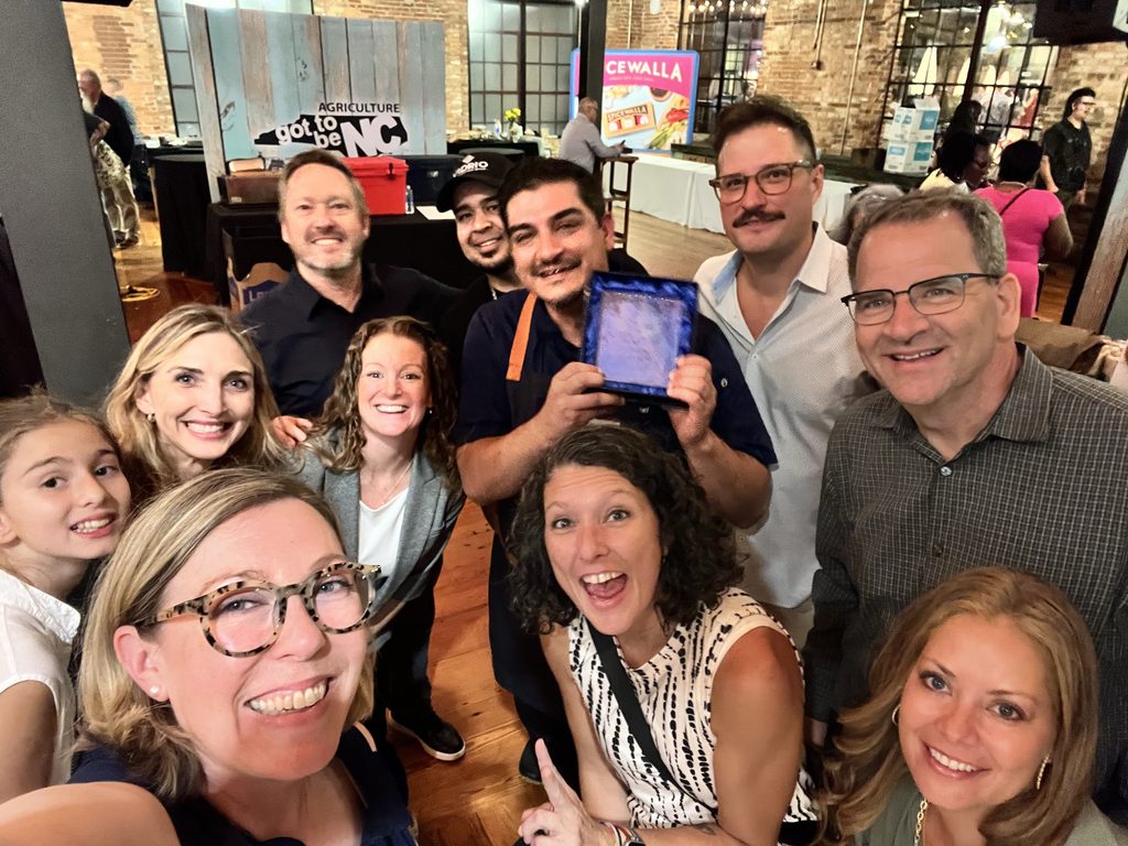 LMR Home Office team members and Chef Roberto of Vidrio (Raleigh, NC), posing with Chef's award at the NCRLA Chef Showdown competition in 2026.