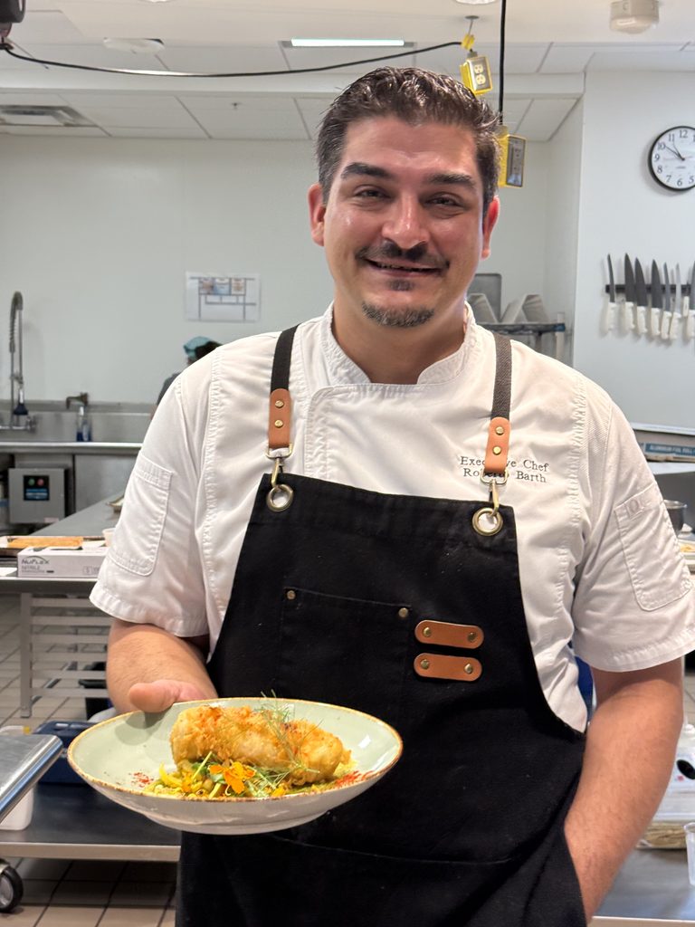 Chef Roberto, Executive Chef of Vidrio Raleigh (NC), posing with one of his award winning dishes.
