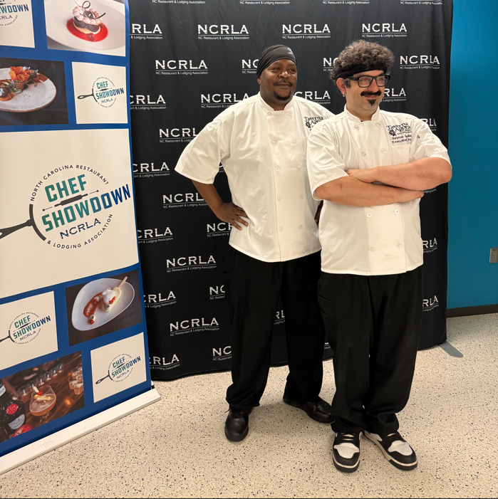 Chef Spyros of Taverna Agora (Raleigh, NC), posing with his team at the NCRLA Chef Showdown competition in 2026.